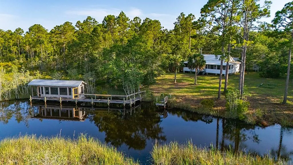 Doyle Creek Frontage on 10 Acres with Private Dock, Covered Boathouse, and Deep Shade Near Apalachicola