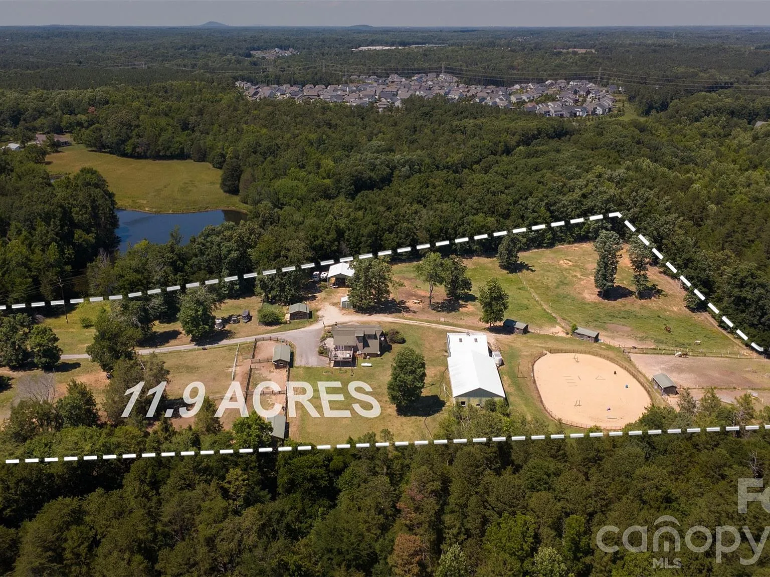 Horse Farm with 10-Stall Barn, Arena, and Five Paddocks on 12 Acres Near Lake Wylie