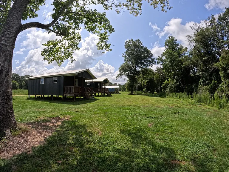 Spring-Fed Creeks and 82 Wooded Acres with Pavilion, Bunk Cabins, and a Stocked Pond Near the Bogue Chitto River