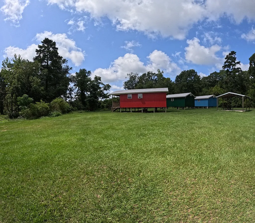 Spring-Fed Creeks and 82 Wooded Acres with Pavilion, Bunk Cabins, and a Stocked Pond Near the Bogue Chitto River