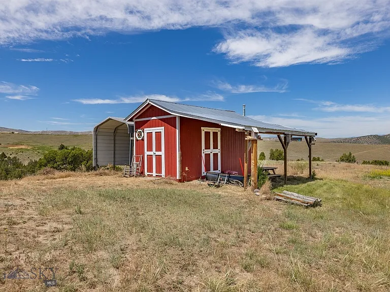 Nearly 10 Gallatin Valley Acres with Pond, Furnished Guest Cabin, Two-Stall Barn, and Six Powered Outbuildings Near Three Forks