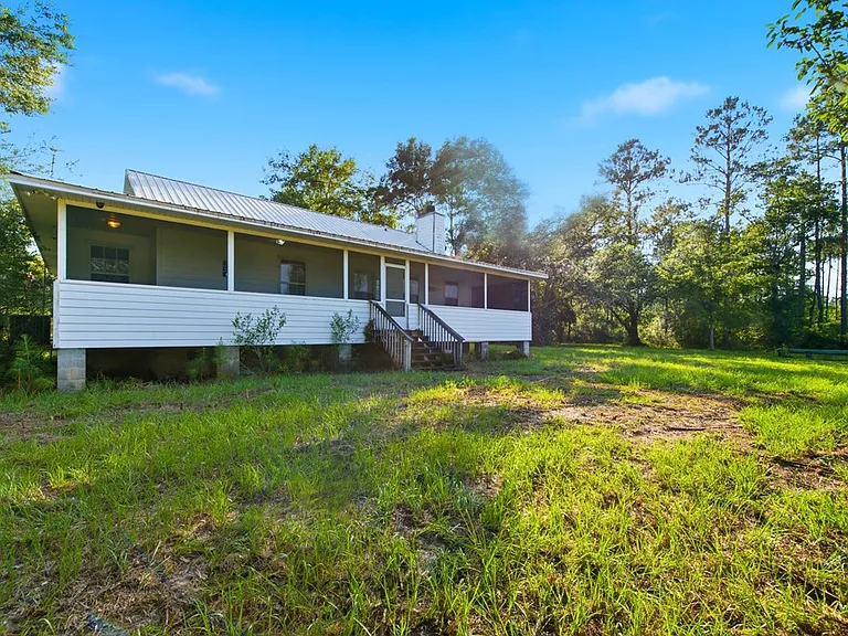 Doyle Creek Frontage on 10 Acres with Private Dock, Covered Boathouse, and Deep Shade Near Apalachicola