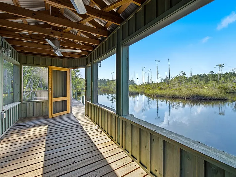 Doyle Creek Frontage on 10 Acres with Private Dock, Covered Boathouse, and Deep Shade Near Apalachicola