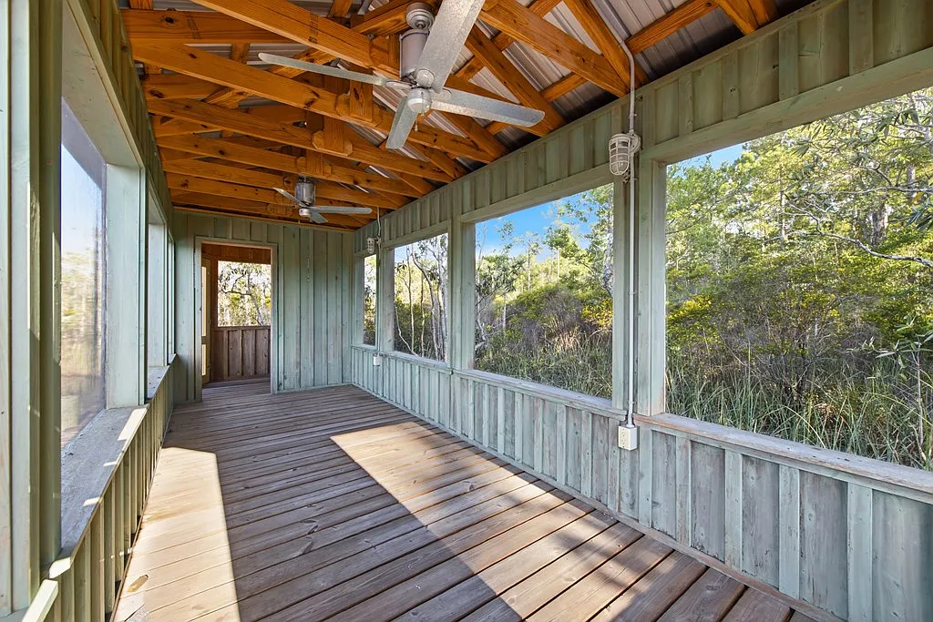 Doyle Creek Frontage on 10 Acres with Private Dock, Covered Boathouse, and Deep Shade Near Apalachicola