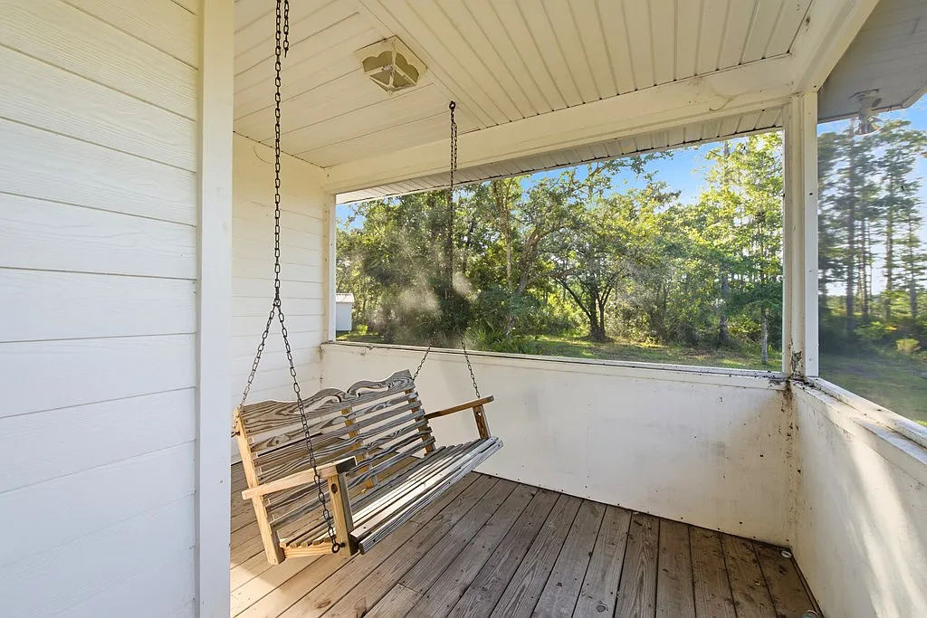 Doyle Creek Frontage on 10 Acres with Private Dock, Covered Boathouse, and Deep Shade Near Apalachicola
