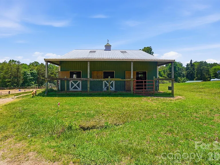 Horse Farm with 10-Stall Barn, Arena, and Five Paddocks on 12 Acres Near Lake Wylie