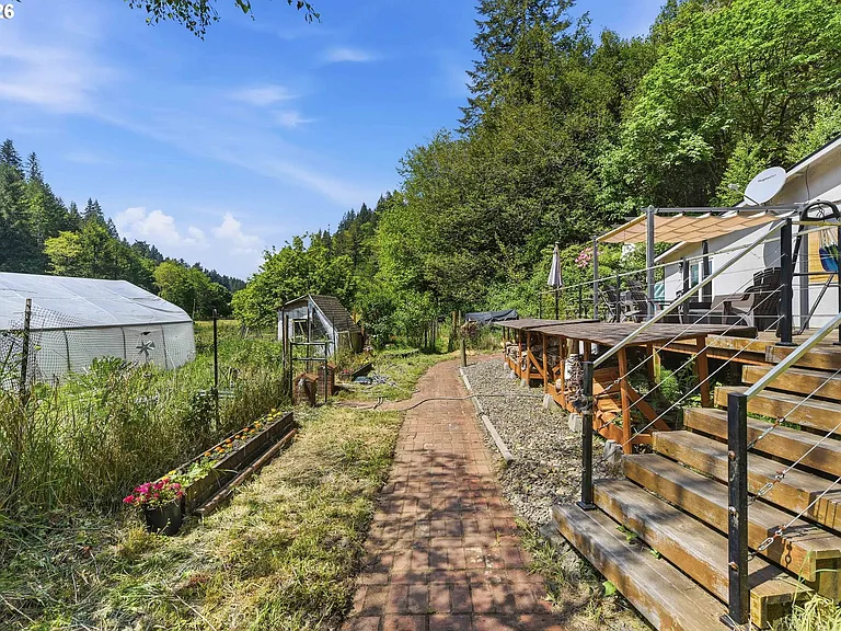 Lodge-Style Home with Salmon Stream on 22 Acres Bordering BLM and Elliott State Forest