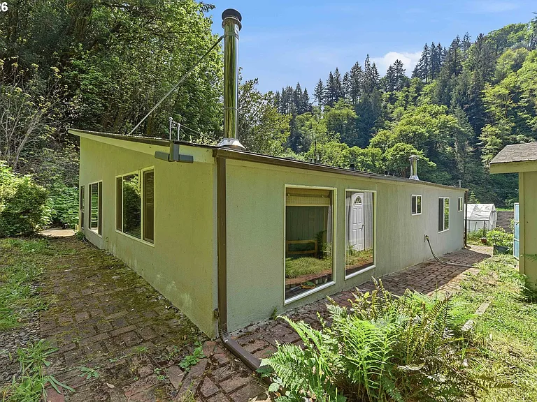 Lodge-Style Home with Salmon Stream on 22 Acres Bordering BLM and Elliott State Forest