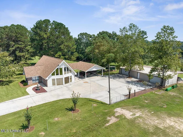 Turnkey Brick Farmhouse with Three Barns, Two Ponds, and 125 Acres Near McComb