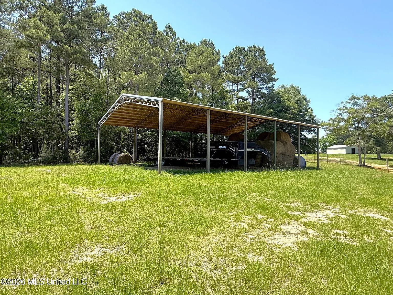 Turnkey Brick Farmhouse with Three Barns, Two Ponds, and 125 Acres Near McComb