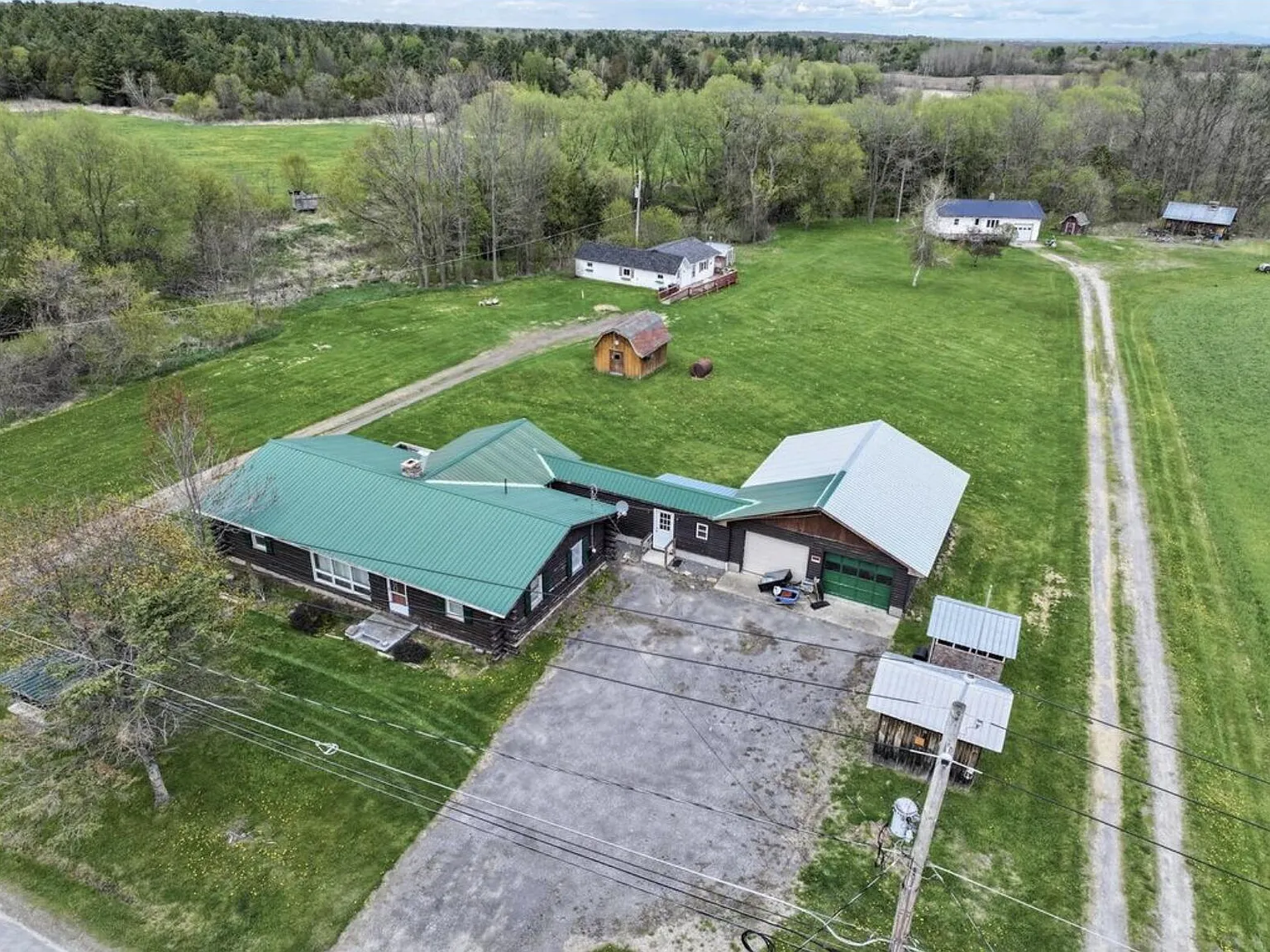 Four-Home Farm with Dairy Barn and Maple Sugar Shack on 168 Acres in West Chazy