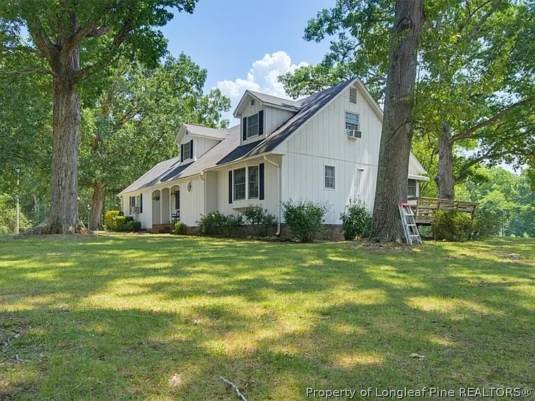 A Farmhouse With Its Own Barn on 9 Wooded Acres