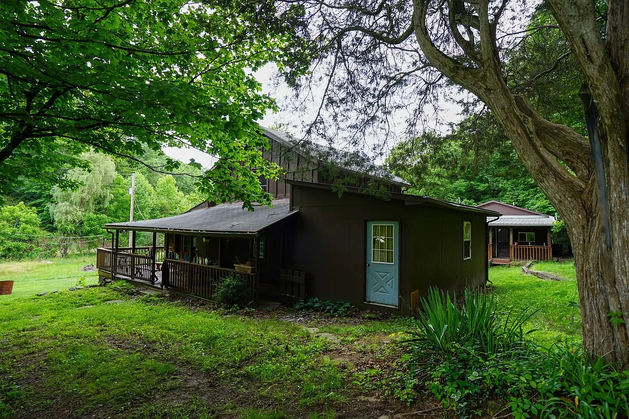Farmhouse and Cabin on 57 Acres with a Cave and Waterfall in Noble County