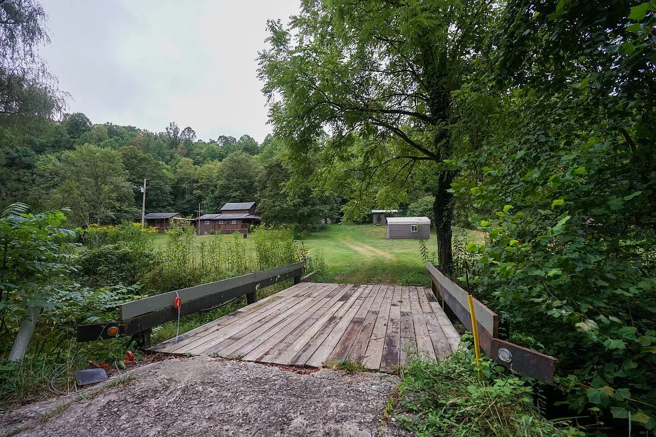 Farmhouse and Cabin on 57 Acres with a Cave and Waterfall in Noble County
