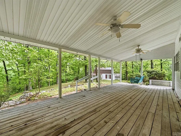 One-Owner Homestead with Private Pond on 11 Rolling Acres in the Ouachita Mountains