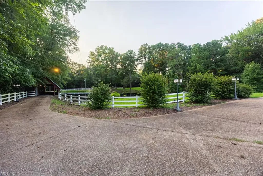 Custom Estate with Pond, Bridge Entrance, and Wooded Trails on 12 Acres Near I-95