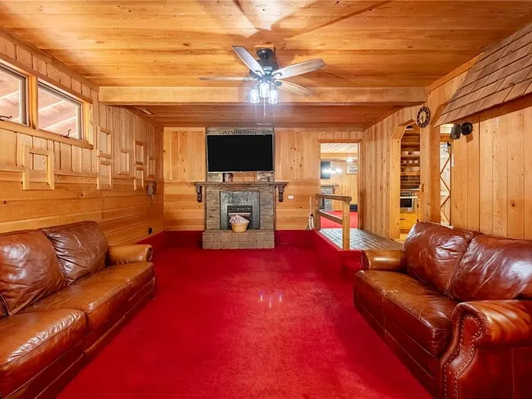 Custom Estate with Pond, Bridge Entrance, and Wooded Trails on 12 Acres Near I-95