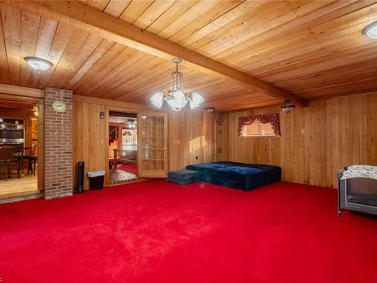 Custom Estate with Pond, Bridge Entrance, and Wooded Trails on 12 Acres Near I-95