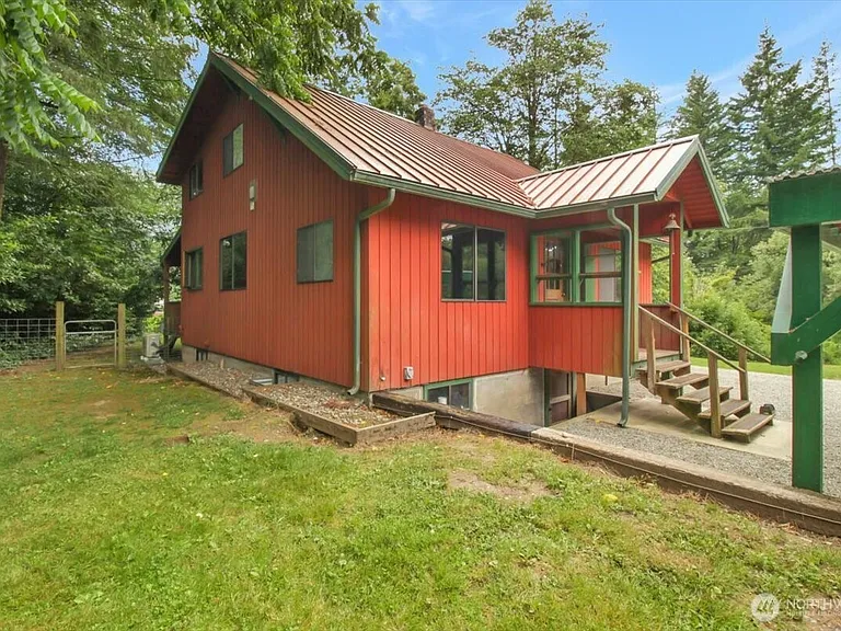 1929 Country Homestead with Deeded River Frontage and a Full Outbuilding Package on 11 Cascade Foothills Acres