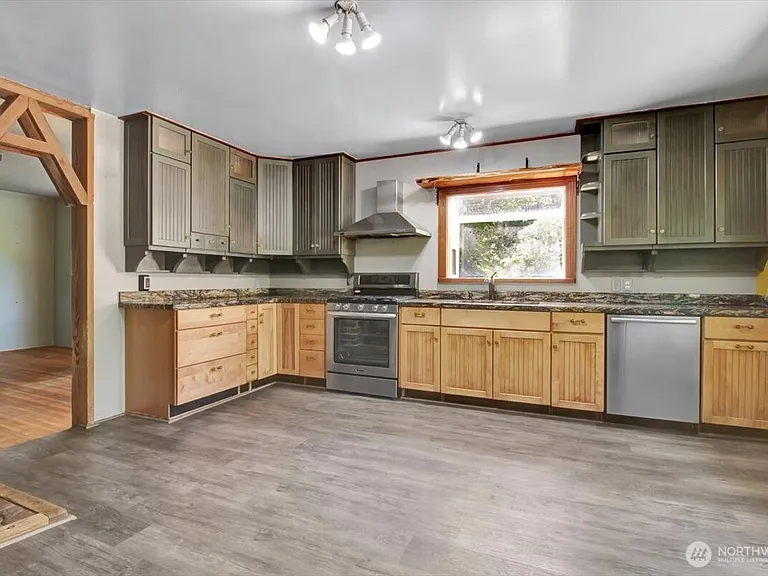 1929 Country Homestead with Deeded River Frontage and a Full Outbuilding Package on 11 Cascade Foothills Acres