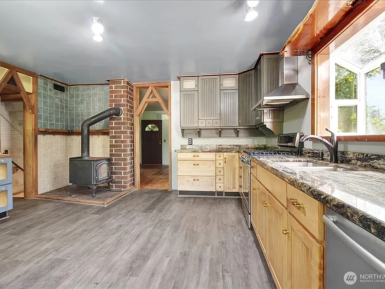 1929 Country Homestead with Deeded River Frontage and a Full Outbuilding Package on 11 Cascade Foothills Acres
