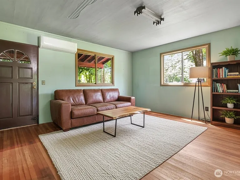1929 Country Homestead with Deeded River Frontage and a Full Outbuilding Package on 11 Cascade Foothills Acres