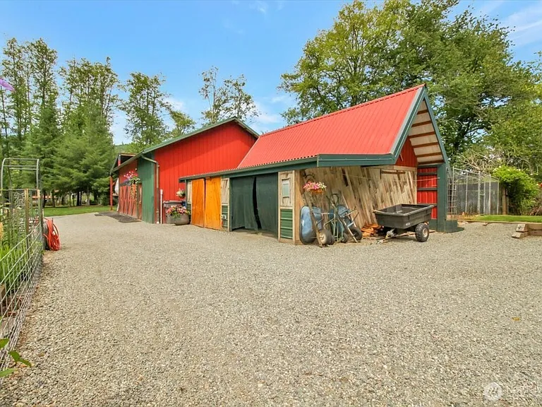 1929 Country Homestead with Deeded River Frontage and a Full Outbuilding Package on 11 Cascade Foothills Acres