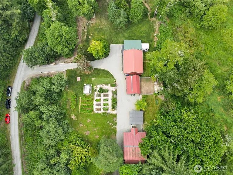 1929 Country Homestead with Deeded River Frontage and a Full Outbuilding Package on 11 Cascade Foothills Acres