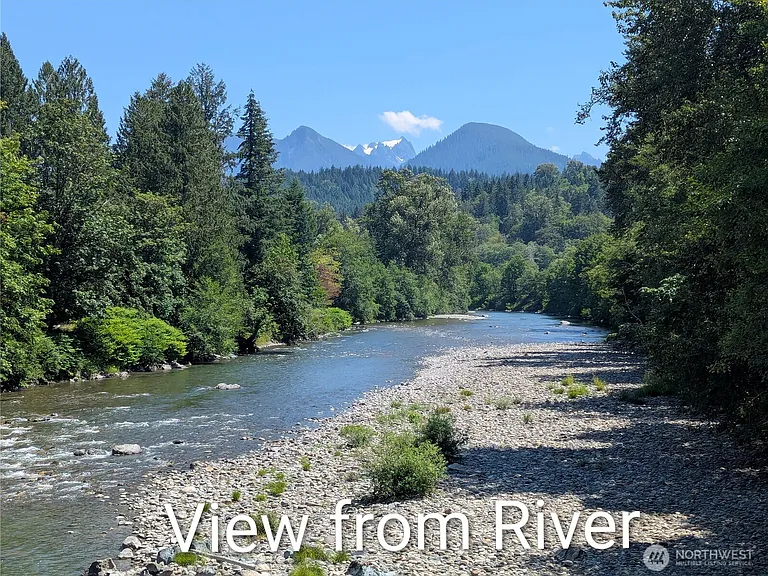 1929 Country Homestead with Deeded River Frontage and a Full Outbuilding Package on 11 Cascade Foothills Acres