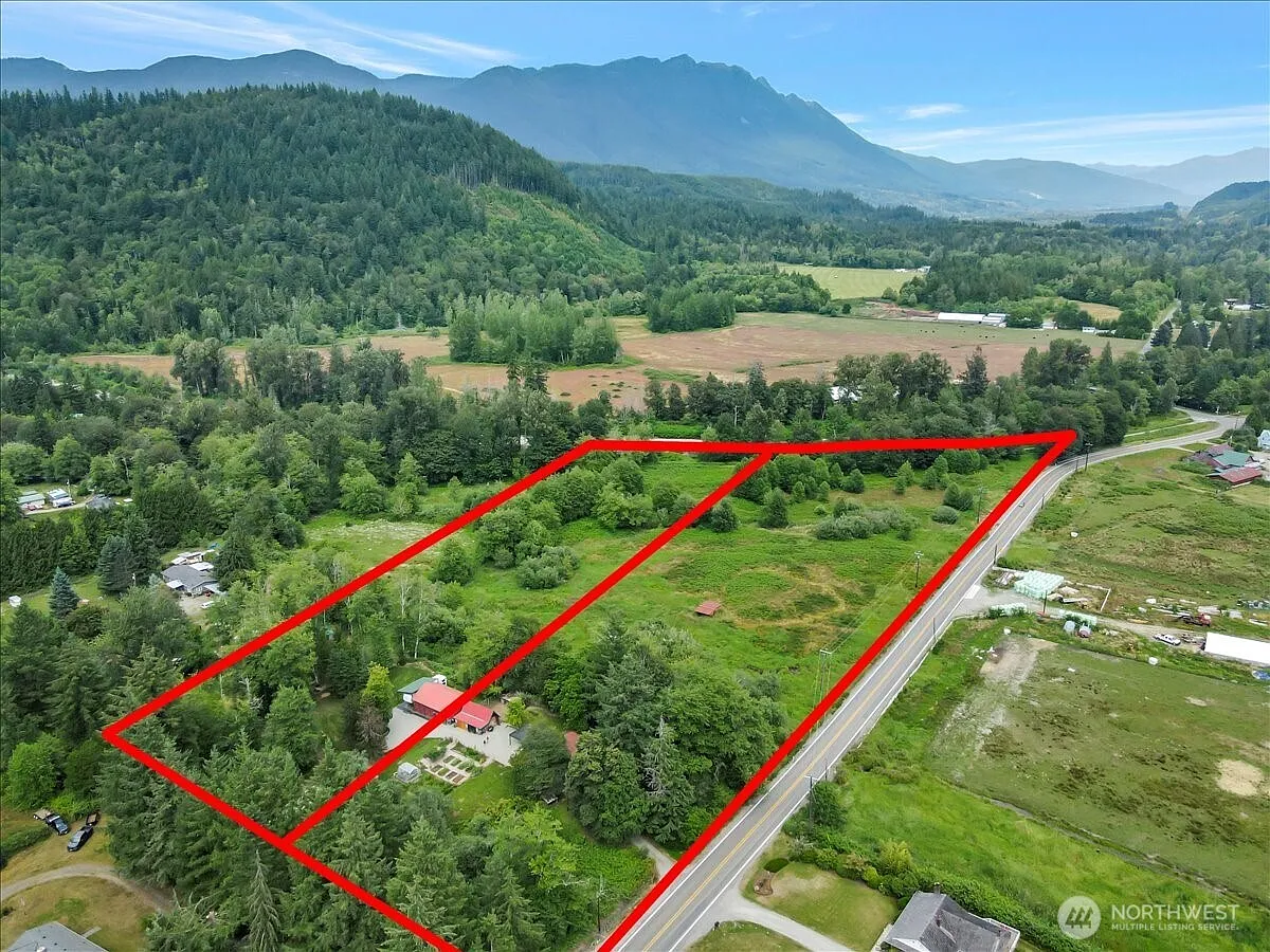 1929 Country Homestead with Deeded River Frontage and a Full Outbuilding Package on 11 Cascade Foothills Acres