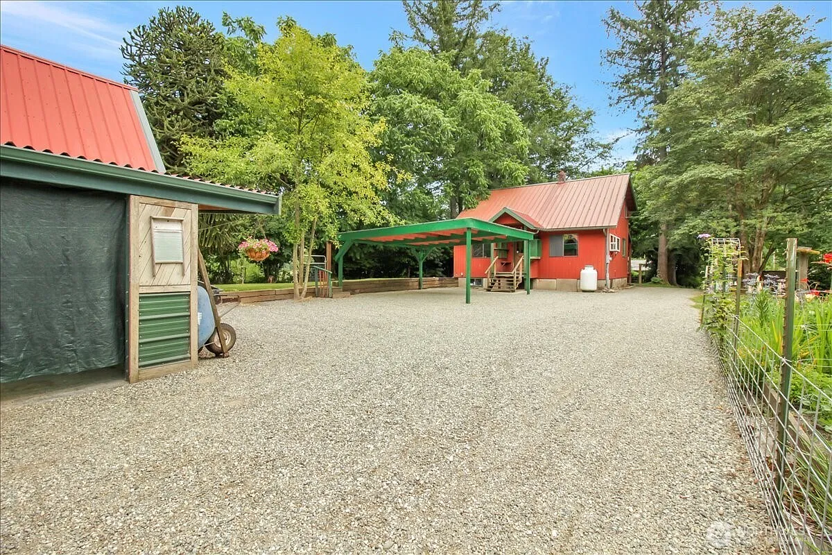 1929 Country Homestead with Deeded River Frontage and a Full Outbuilding Package on 11 Cascade Foothills Acres