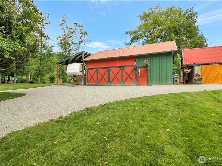 1929 Country Homestead with Deeded River Frontage and a Full Outbuilding Package on 11 Cascade Foothills Acres