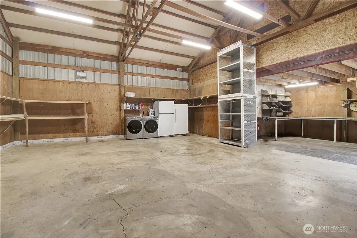 1929 Country Homestead with Deeded River Frontage and a Full Outbuilding Package on 11 Cascade Foothills Acres