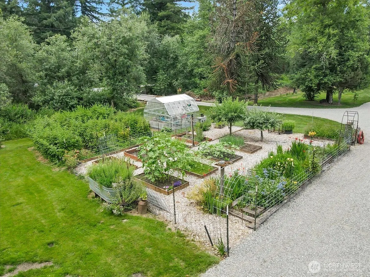 1929 Country Homestead with Deeded River Frontage and a Full Outbuilding Package on 11 Cascade Foothills Acres