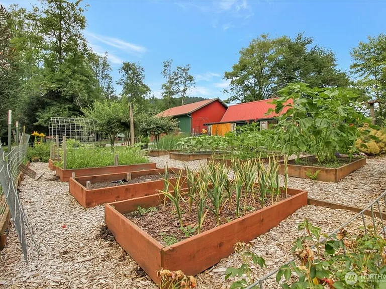 1929 Country Homestead with Deeded River Frontage and a Full Outbuilding Package on 11 Cascade Foothills Acres