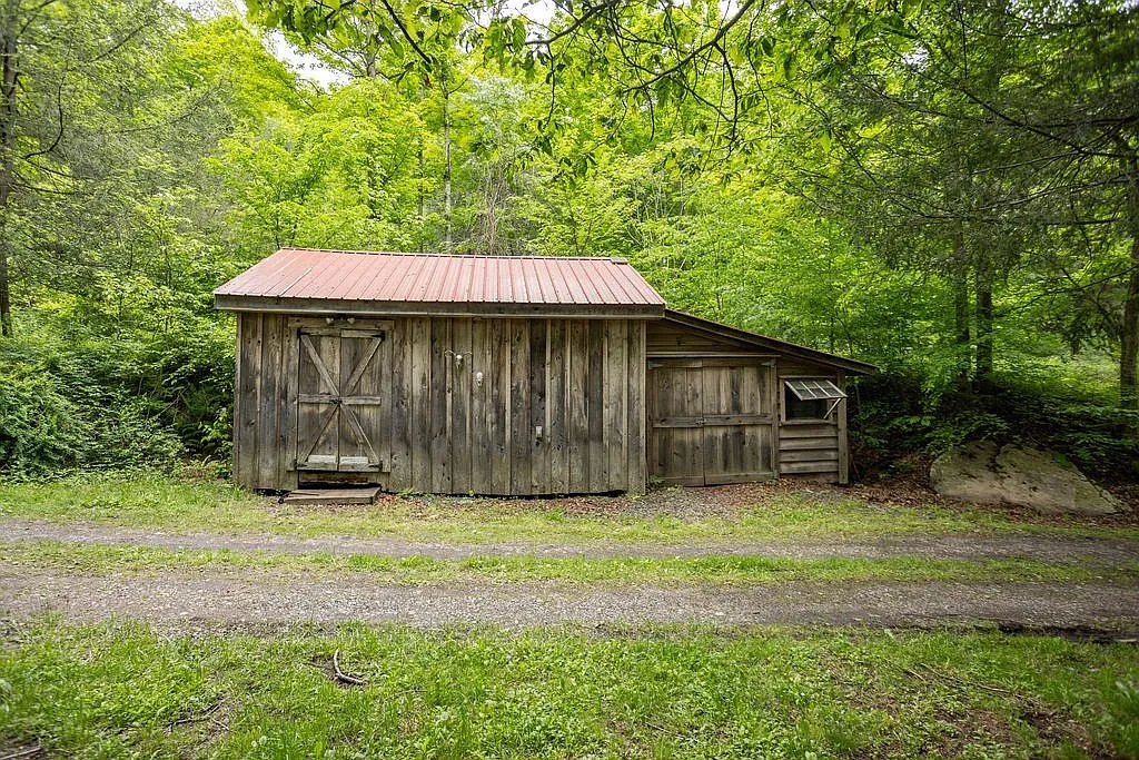 A Charming Cabin on 10 Wooded Acres Along a Babbling Stream