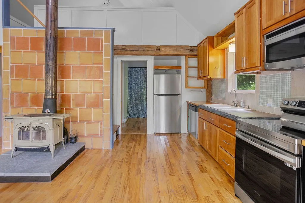 A Charming Cabin on 10 Wooded Acres Along a Babbling Stream