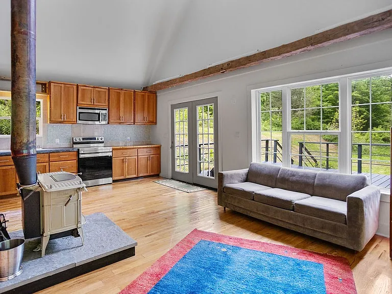 A Charming Cabin on 10 Wooded Acres Along a Babbling Stream
