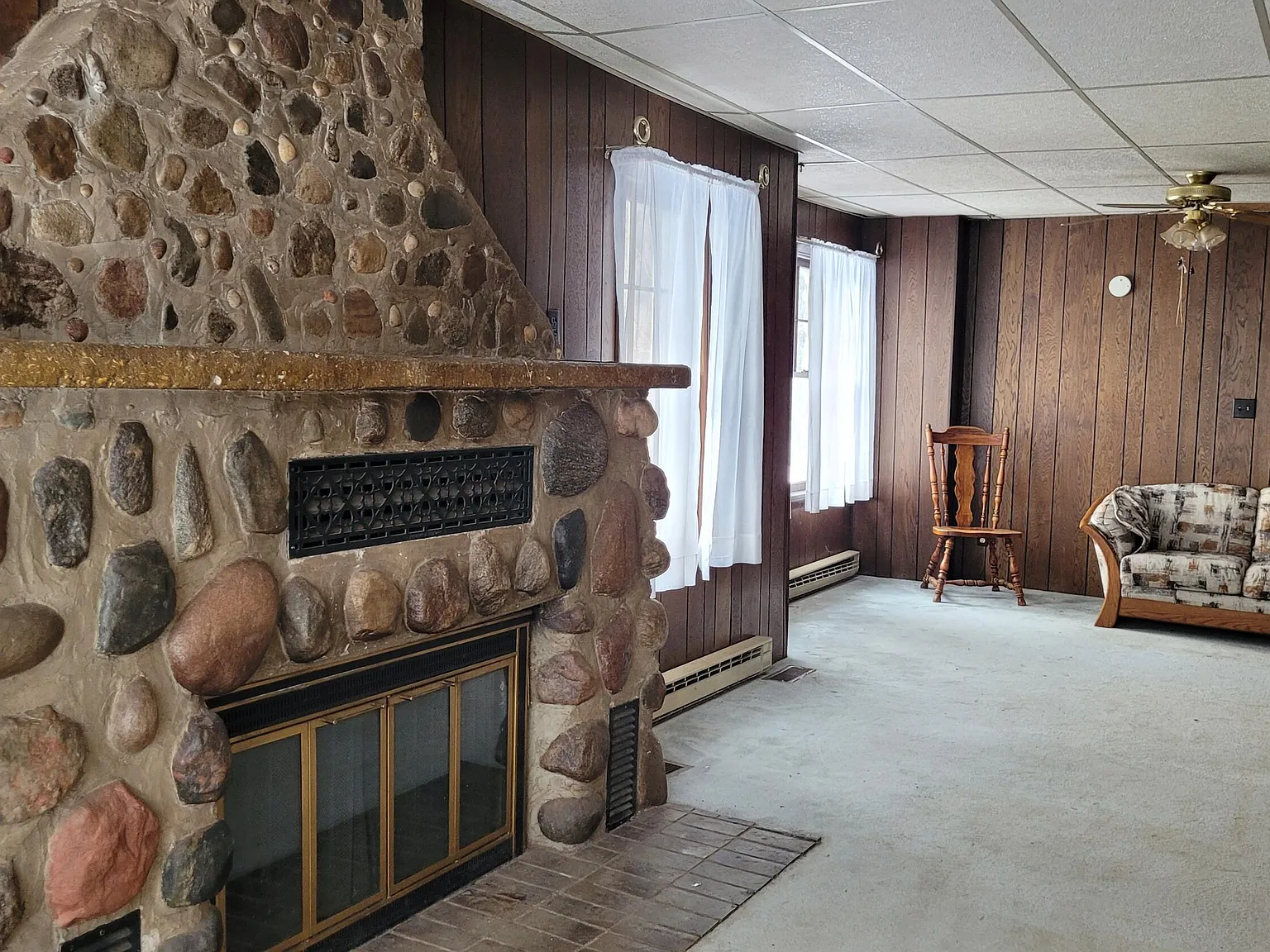 Three-Generation Stone Farmstead with Greenhouse, Barn, and Pond on 30 Acres Near Sault Sainte Marie