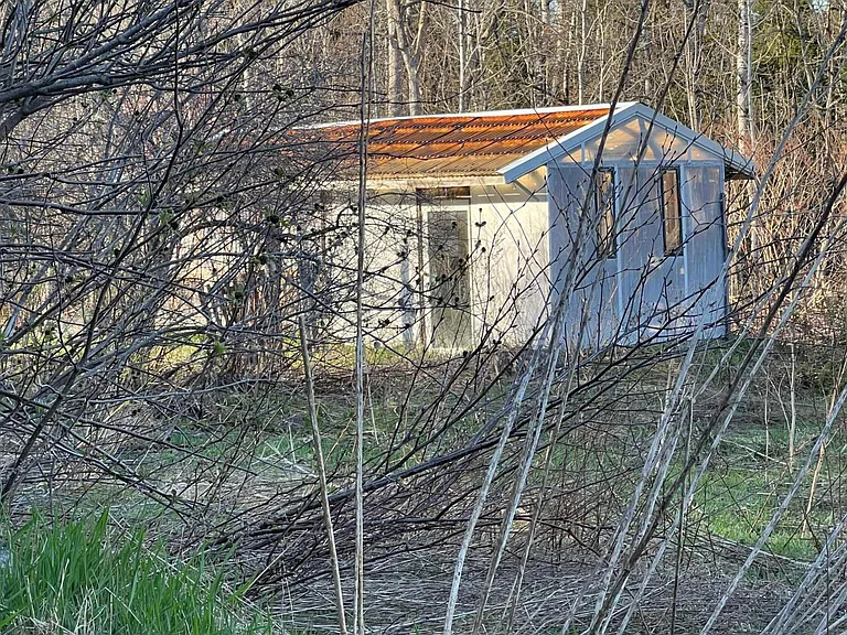 Three-Generation Stone Farmstead with Greenhouse, Barn, and Pond on 30 Acres Near Sault Sainte Marie