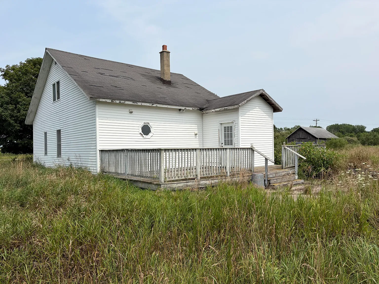 A Fixer-Upper Farmhouse on 10 Wide-Open Acres