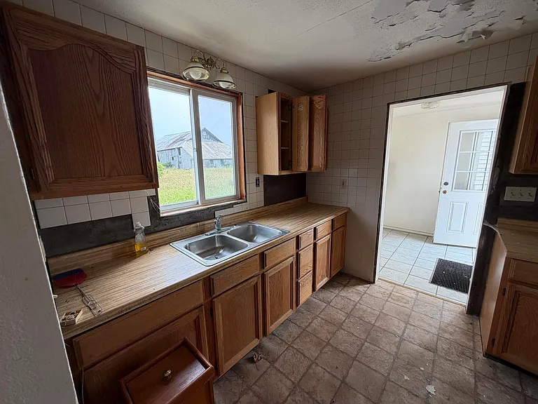 A Fixer-Upper Farmhouse on 10 Wide-Open Acres