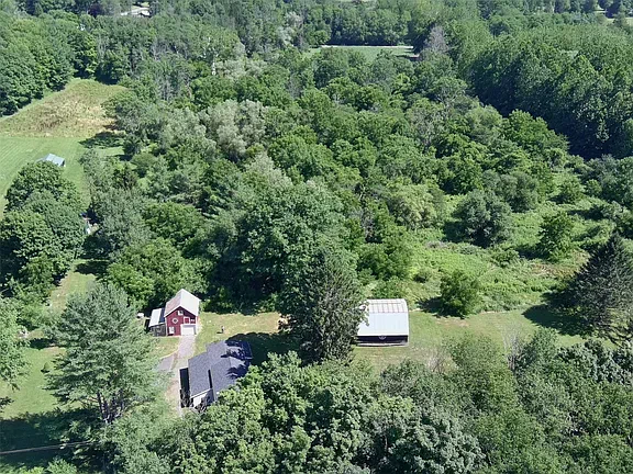 A Creek-Side Homestead With Two Barns, Ready to Reimagine