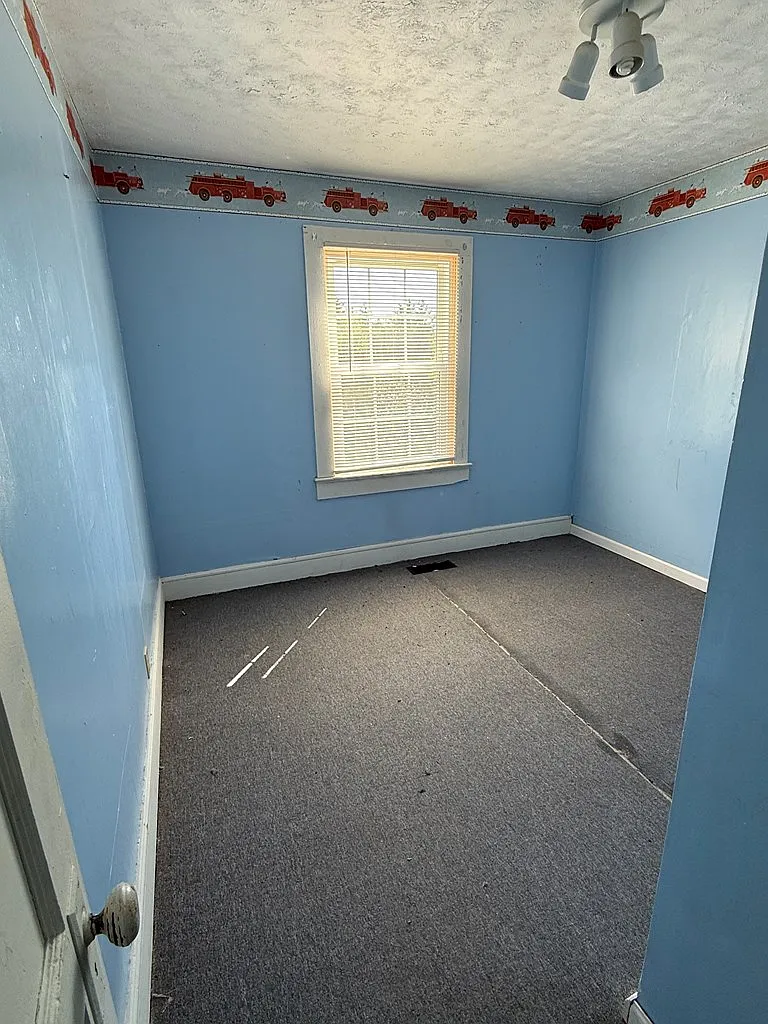 Cottage with Spring-Fed Pond and Fenced Field on 4.59 Acres Near the New River