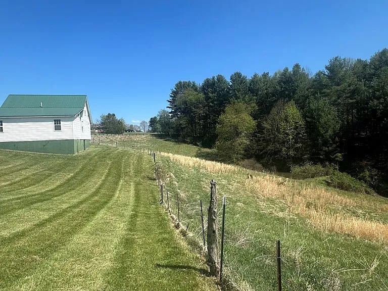 Cottage with Spring-Fed Pond and Fenced Field on 4.59 Acres Near the New River