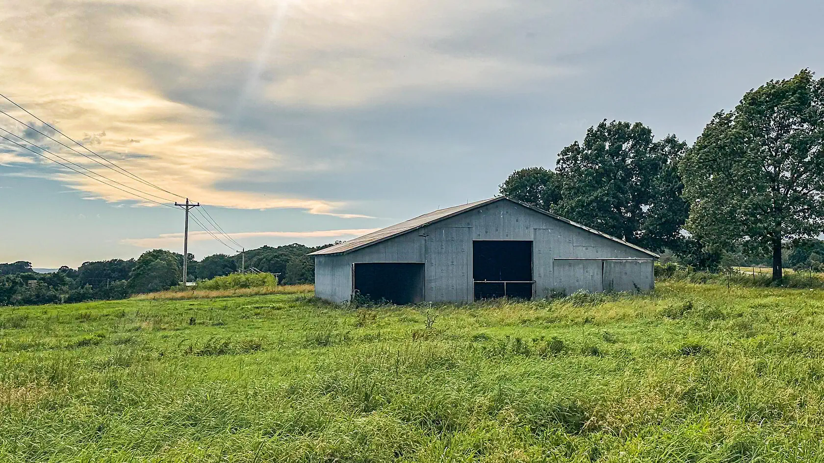 1923 Ozark Farmhouse with Pond, Shop, and Barn Near Hartville