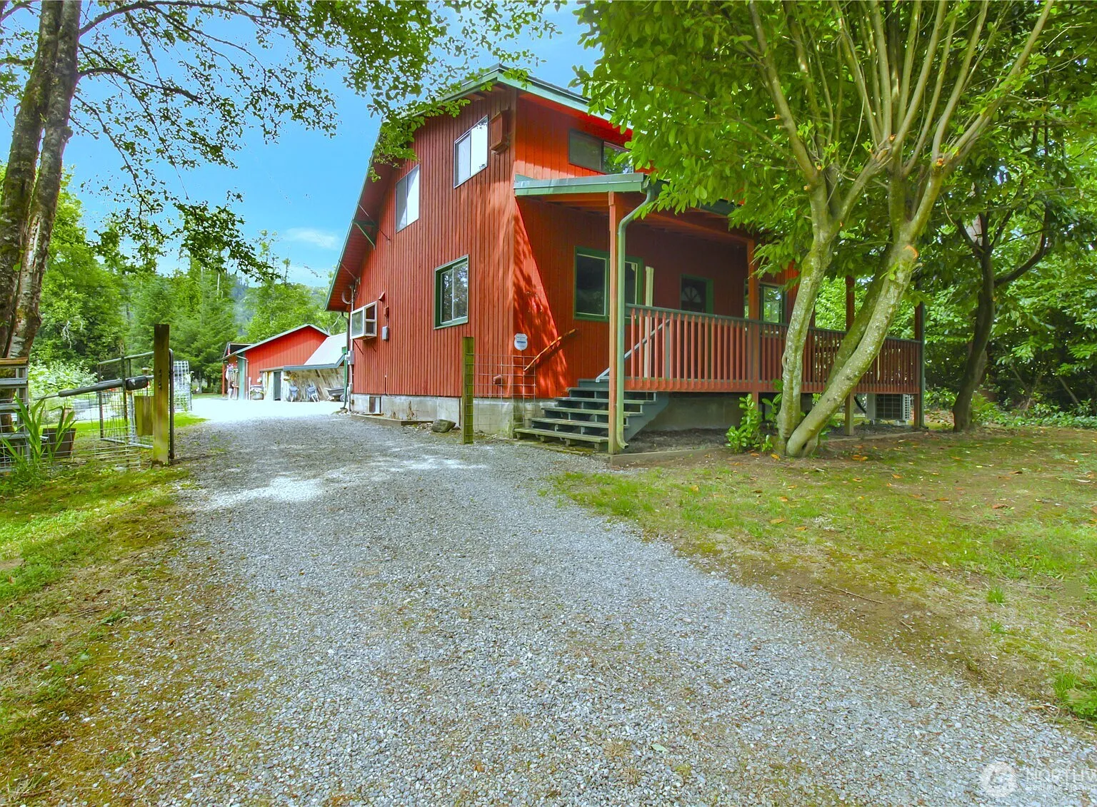 1929 Country Homestead with Deeded River Frontage and a Full Outbuilding Package on 11 Cascade Foothills Acres