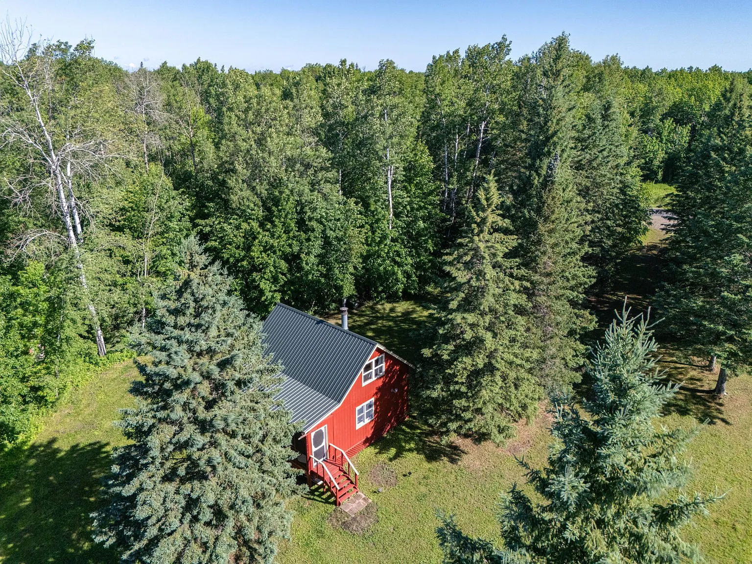 41 Acres on the Sturgeon River, With a Fully Furnished 1900 Cabin