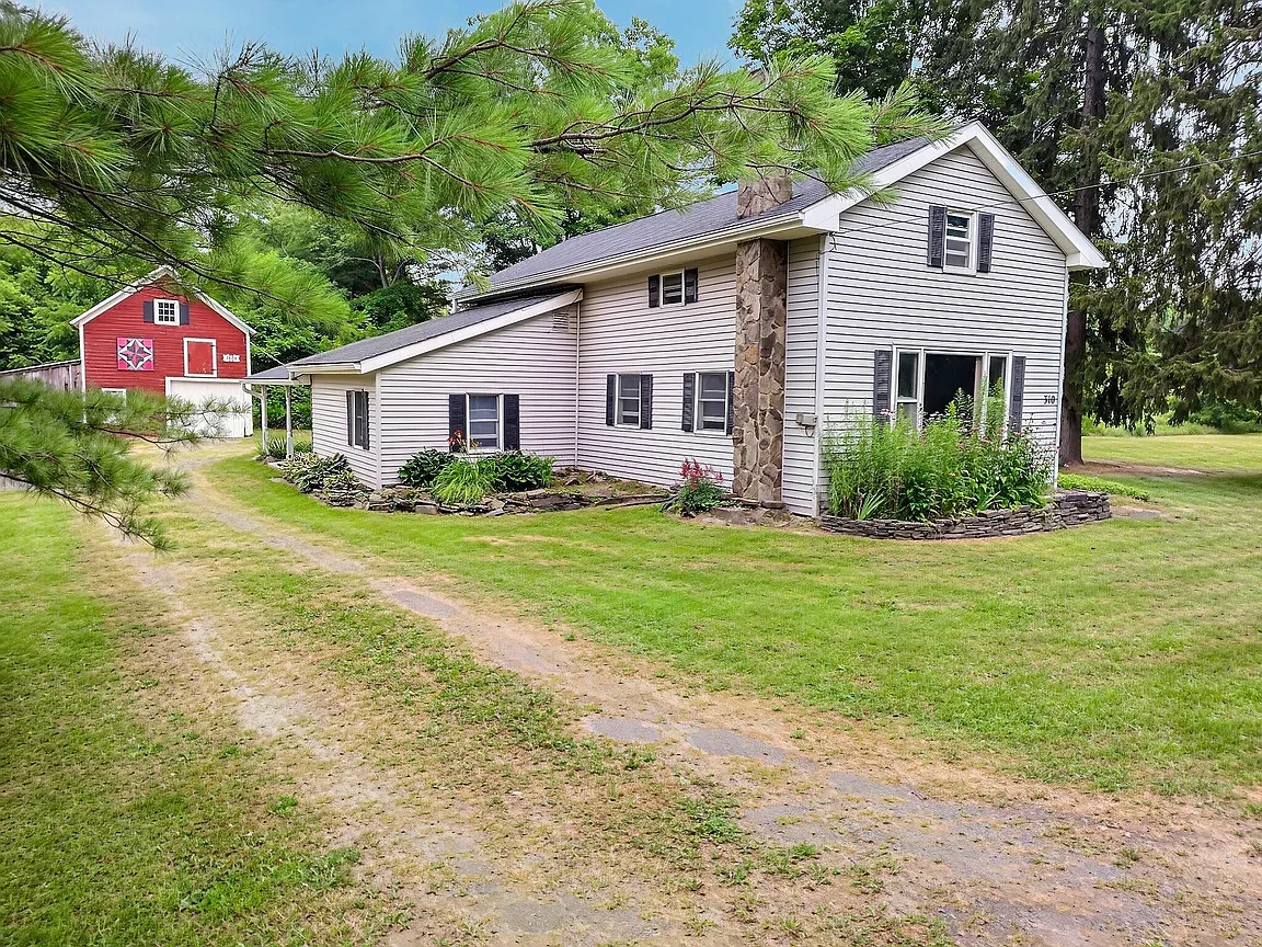 A Creek-Side Homestead With Two Barns, Ready to Reimagine